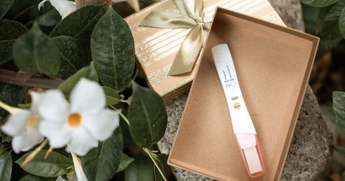 A photo of pregnancy test kit in a gift box.